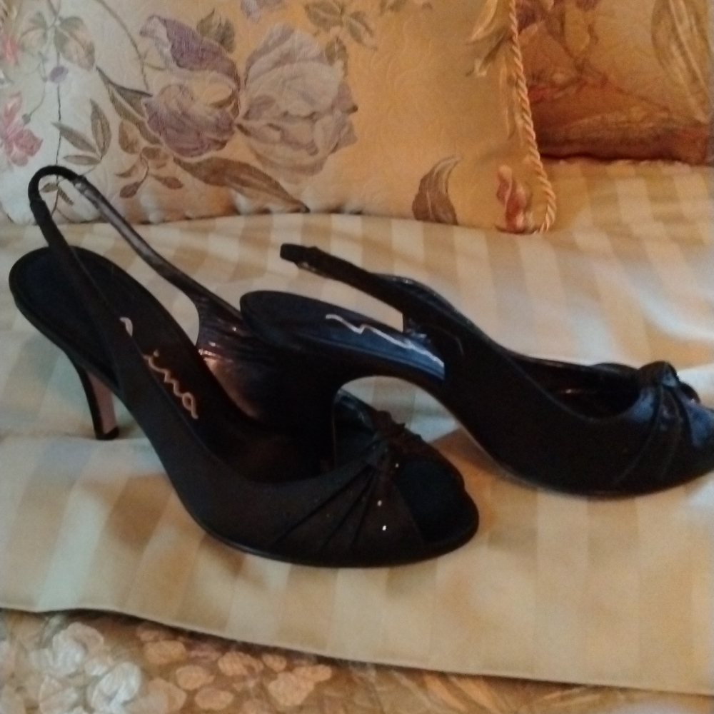 Pretty black satin dress shoes with black rhinestones.